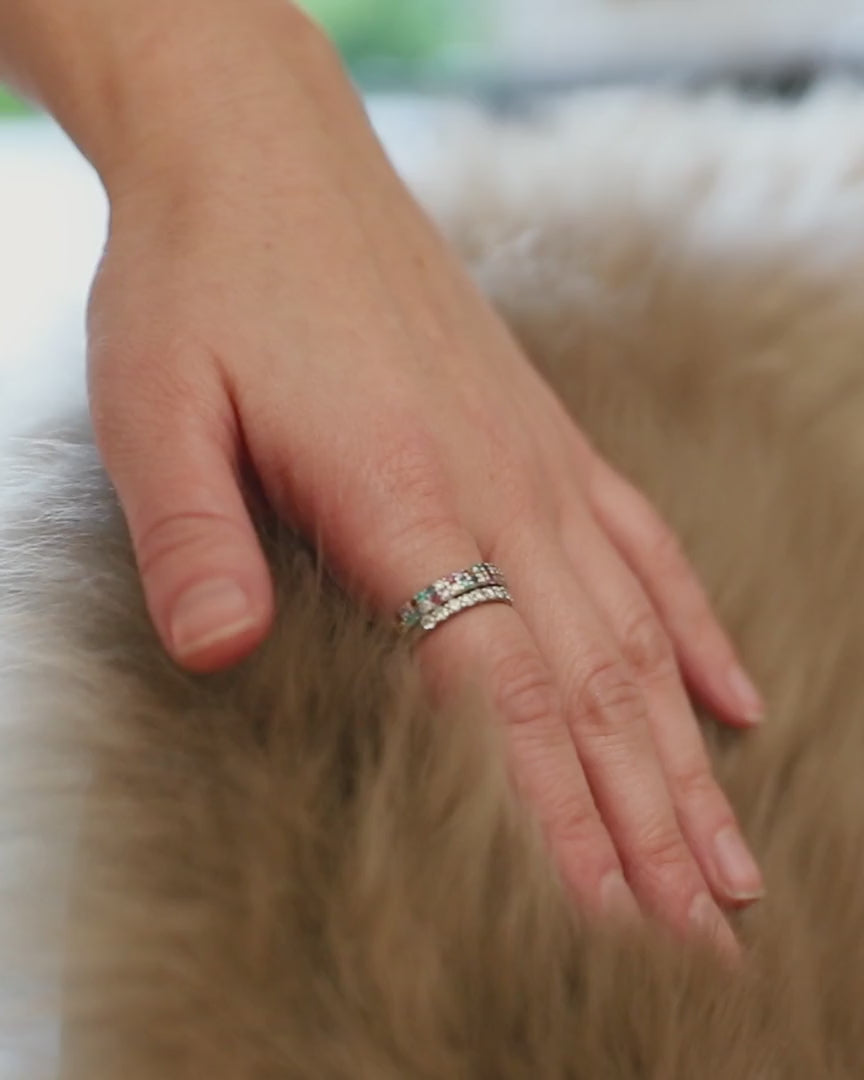 A hand stroking long wool sheepskin